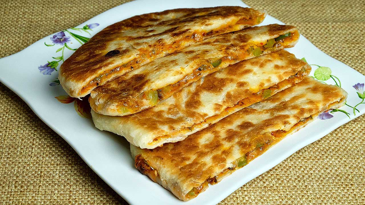 Read more about the article (Video) Pizza Paratha Recipe | Your Kid Will Love This Indian Pizza